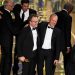 Tom McCarthy, center left, and Michael Keaton, center right, accept the award for best picture for 