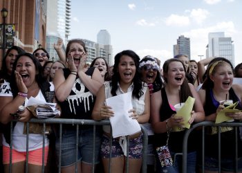 Fans scream when they think they see Justin Bieber outside American Airlines Center before he performs on July 3, 2013 in Dallas. (Sarah Hoffman/The Dallas Morning News) 07042013xNEWS