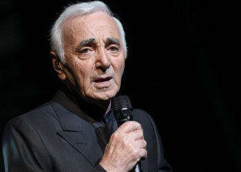 French crooner Charles Aznavour performs on stage at the Olympia concert hall in Paris on September 7, 2011 in Paris. The legendary singer-songwriter pleased fans the world over when he announced plans for a month-long residency at Paris' landmark Olympia theatre starting September 7, followed by a nationwide tour. AFP PHOTO / PIERRE VERDY