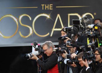 HOLLYWOOD, CA - FEBRUARY 24:  Photographers cover the red carpet arrivals to the 85th Annual Academy Awards at the Hollywood & Highland Center on February 24, 2012 in Hollywood, California.  (Photo by David McNew/Getty Images)