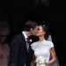 Pippa Middleton (R) kisses her new husband James Matthews, following their wedding ceremony at St Mark's Church in Englefield, west of London, on May 20, 2017.
After turning heads at her sister Kate's wedding to Prince William, Pippa Middleton graduated from bridesmaid to bride on Saturday at a star-studded wedding in an English country church. The 33-year-old married financier James Matthews, 41, at a ceremony attended by the royal couple and tennis star Roger Federer, wearing a couture dress by British designer Giles Deacon.
 / AFP PHOTO / POOL / Justin TALLIS