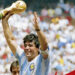 MEXICO CITY, MEXICO - JUNE 29: Diego Maradona of Argentina holds the World Cup trophy after defeating West Germany 3-2 during the 1986 FIFA World Cup Final match at the Azteca Stadium on June 29, 1986 in Mexico City, Mexico. (Photo by Archivo El Grafico/Getty Images)