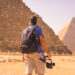 A young photographer at the pyramid of Cheops the largest pyramid. The pyramids of Giza the oldest funerary monument in the world. In the city of Cairo, Egypt